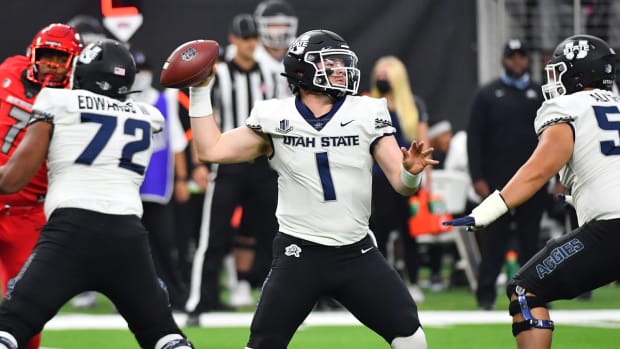 Oct 16, 2021; Paradise, Nevada, USA; Utah State Aggies quarterback Logan Bonner (1) looks to throw against the UNLV Rebels at Allegiant Stadium. Mandatory Credit: Stephen R. Sylvanie-USA TODAY Sports